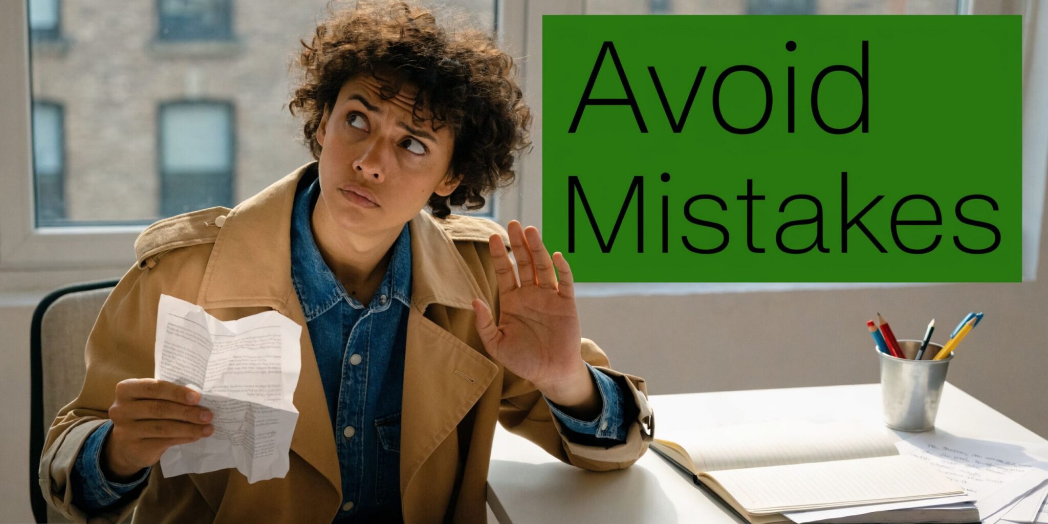 A concerned woman holding a crumpled piece of paper while gesture stop with a serious expression.